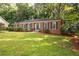 Well-maintained home with a lush green lawn, complemented by established landscaping at 1342 Old Johnson Ferry Ne Rd, Brookhaven, GA 30319
