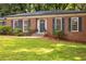 Classic brick home with beautiful landscaping and a welcoming front entrance at 1342 Old Johnson Ferry Ne Rd, Brookhaven, GA 30319