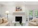 Living room featuring fireplace and French doors at 1342 Old Johnson Ferry Ne Rd, Brookhaven, GA 30319