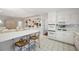 Bright eat-in kitchen with bar seating and stainless steel appliances at 1342 Old Johnson Ferry Ne Rd, Brookhaven, GA 30319