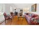 Cozy living room featuring hardwood floors, bright windows, and classic furniture at 1342 Old Johnson Ferry Ne Rd, Brookhaven, GA 30319