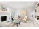 Inviting living room featuring a white-painted fireplace and double French doors at 1342 Old Johnson Ferry Ne Rd, Brookhaven, GA 30319