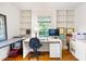 Bright office space with natural light, built-in shelving, and hardwood flooring at 1342 Old Johnson Ferry Ne Rd, Brookhaven, GA 30319
