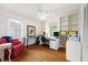 Home office featuring built-in bookshelves, hardwood floors, and abundant natural light at 1342 Old Johnson Ferry Ne Rd, Brookhaven, GA 30319