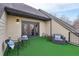 Enjoy fresh air on this covered outdoor balcony with artificial turf at 255 Southerland Ne Ter # 207, Atlanta, GA 30307
