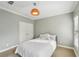 This cozy bedroom offers a queen bed, carpeted floors, and a closet at 255 Southerland Ne Ter # 207, Atlanta, GA 30307