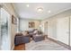 Relaxing living room area with a gray sectional sofa, textured rug, and natural light at 255 Southerland Ne Ter # 207, Atlanta, GA 30307