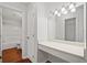 Vanity area with large mirrors in a bathroom featuring a shower/tub combo and tile floors at 3655 Habersham Road Northeast Ne Rd # B249, Atlanta, GA 30305