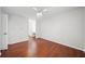Spacious bedroom includes hardwood floors, a ceiling fan, and an en suite bathroom at 3655 Habersham Road Northeast Ne Rd # B249, Atlanta, GA 30305