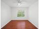 Bedroom features hardwood floors, a ceiling fan, and window overlooking the trees outside at 3655 Habersham Road Northeast Ne Rd # B249, Atlanta, GA 30305