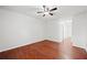 Large bedroom featuring warm hardwood floors and neutral walls with door to a bathroom at 3655 Habersham Road Northeast Ne Rd # B249, Atlanta, GA 30305
