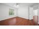 This bedroom boasts hardwood floors, a ceiling fan, and large windows with natural light at 3655 Habersham Road Northeast Ne Rd # B249, Atlanta, GA 30305