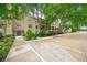 Exterior view of building with parking, sidewalk, and surrounding trees and shrubs at 3655 Habersham Road Northeast Ne Rd # B249, Atlanta, GA 30305