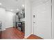 Modern kitchen with stainless appliances and dark cabinets next to white front door at 3655 Habersham Road Northeast Ne Rd # B249, Atlanta, GA 30305