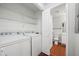Convenient laundry area with washer, dryer, and storage shelving, easily accessible at 3655 Habersham Road Northeast Ne Rd # B249, Atlanta, GA 30305