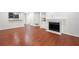 Open floor plan offers hardwood floors, fireplace, and view to the kitchen and other rooms at 3655 Habersham Road Northeast Ne Rd # B249, Atlanta, GA 30305