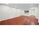 Bright living room features recessed lighting, hardwood floors, and an open view to the kitchen at 3655 Habersham Road Northeast Ne Rd # B249, Atlanta, GA 30305