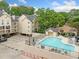 Community pool with lounge chairs and umbrellas offers a relaxing escape at 3655 Habersham Road Northeast Ne Rd # B249, Atlanta, GA 30305