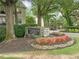 Stone sign for The Habersham of Buckhead, surrounded by lush, colorful landscaping and mature trees at 3655 Habersham Road Northeast Ne Rd # B249, Atlanta, GA 30305