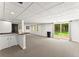 Spacious finished basement with a bar, recessed lighting, and sliding glass doors to the backyard at 6875 Sunny Brook Lane Northeast, Sandy Springs, GA 30328