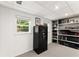 Basement featuring a secure safe, built in bookshelves, and carpet flooring, providing secure storage at 6875 Sunny Brook Lane Northeast, Sandy Springs, GA 30328