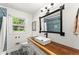 Updated bathroom with modern vanity, vessel sink, and a decorative mirror, creating a spa-like experience at 6875 Sunny Brook Lane Northeast, Sandy Springs, GA 30328