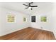 Sunny bedroom with three windows and hardwood floors at 6875 Sunny Brook Lane Northeast, Sandy Springs, GA 30328