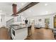 Open-concept kitchen with granite countertops, stainless steel appliances, and a view of the living area at 6875 Sunny Brook Lane Northeast, Sandy Springs, GA 30328