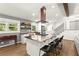 Kitchen with stainless appliances, island seating, and an open concept layout, creating a chef's paradise at 6875 Sunny Brook Lane Northeast, Sandy Springs, GA 30328