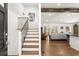 Inviting interior with a staircase and open living room, featuring hardwood floors and ample natural light at 6875 Sunny Brook Lane Northeast, Sandy Springs, GA 30328
