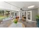 Bright sunroom with slate tile flooring and multiple entry points, perfect for relaxation at 6875 Sunny Brook Lane Northeast, Sandy Springs, GA 30328
