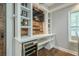 Bar area with built-in shelving, a beverage cooler, and a rustic wood accent wall at 875 Soaring Cir, Marietta, GA 30062