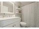 Bathroom featuring a white vanity, shelving and a shower with a decorative curtain at 875 Soaring Cir, Marietta, GA 30062