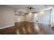 Large bedroom showcasing a tray ceiling, dark hardwood floors, with an ensuite bathroom at 875 Soaring Cir, Marietta, GA 30062