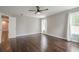 Spacious bedroom featuring hardwood floors, a ceiling fan, and ample natural light from windows at 875 Soaring Cir, Marietta, GA 30062