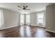 Spacious bedroom with hardwood floors, ceiling fan, and abundant natural light at 875 Soaring Cir, Marietta, GA 30062