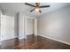 Bedroom boasting hardwood floors, ceiling fan, and closet with folding doors at 875 Soaring Cir, Marietta, GA 30062