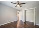 Bedroom featuring hardwood floors, ceiling fan, and closet with folding doors at 875 Soaring Cir, Marietta, GA 30062