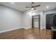 Spacious bedroom features hard wood floors, a ceiling fan, neutral paint, and closet at 875 Soaring Cir, Marietta, GA 30062