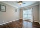Cozy bedroom with hardwood floors, large window and neutral paint at 875 Soaring Cir, Marietta, GA 30062