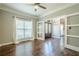 The bonus room features hardwood floors, large windows, and neutral paint at 875 Soaring Cir, Marietta, GA 30062