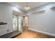 Home gym area with hardwood floors, access to the living area, and neutral paint at 875 Soaring Cir, Marietta, GA 30062