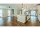 Open-concept kitchen boasts granite countertops, a stainless steel sink, and hardwood floors at 875 Soaring Cir, Marietta, GA 30062