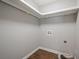 Laundry room hookups with tile floors and white trim, ready for appliances at 875 Soaring Cir, Marietta, GA 30062