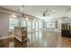 Bright living area featuring a bar, hardwood floors, recessed lighting, and access to the backyard at 875 Soaring Cir, Marietta, GA 30062