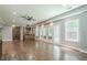 Spacious living area featuring hardwood floors, a bar with seating, and access to the patio at 875 Soaring Cir, Marietta, GA 30062