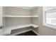 Pantry with wrap around shelving and a window with a view to the exterior at 875 Soaring Cir, Marietta, GA 30062
