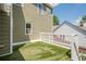 Artificial turf patio with white railing that matches the home's exterior siding at 875 Soaring Cir, Marietta, GA 30062