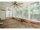 Enclosed patio with stone floors, wood accents, large windows and ceiling fans at 875 Soaring Cir, Marietta, GA 30062
