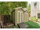 Garden storage shed with a small ramp and painted to match the house at 875 Soaring Cir, Marietta, GA 30062